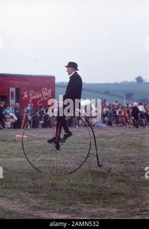 Man on penny Farthing bicycle at a country show in northern England, in 1975 Stock Photo