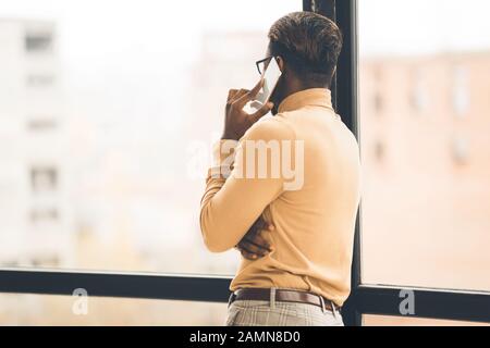 Unrecognizable afro man talking on the phone Stock Photo