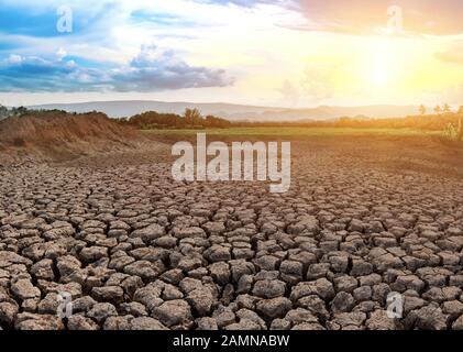 Cracked and dry soil in arid areas landscape, Drought crisis in Thailand Stock Photo