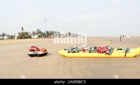 Inflatable adventurous fly fish raft of Fun Jet Ski watercraft wave runner vehicle placed in an empty sea beach for Jet skiing Water sports enthusiast Stock Photo