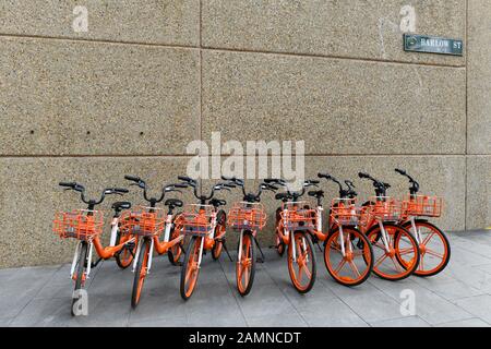 A cluster of e bikes in Barlow Street, Sydney near Central Railway Station. Stock Photo