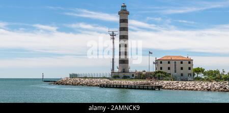 Lido di Jesolo - Veneto, Italy: Adriatic Sea, the lighthouse on the beach at the mouth of the river Sile, Faro di Piave Vecchia Stock Photo