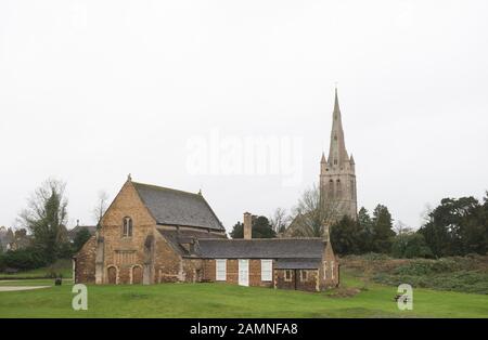 Oakham Castle and All Saints Parish Church, as councillors are set to consider plans to build a McDonald's drive-thru in Rutland - the last county in England without a branch of the fast food chain. Stock Photo