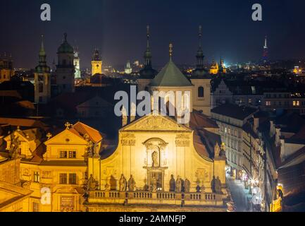 Prague - The Old Town from east tower of Charles bridge with the Klementinum - St. Salvator church at night Stock Photo