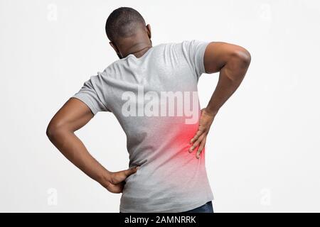 Black man holding his hand behind his back Stock Photo