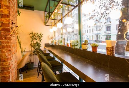 Coffee shop interior design With chairs and red bricks wall Stock Photo