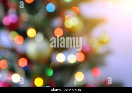 Festive christmas background. Garland lights on the Christmas tree. Blur, out of focus Stock Photo