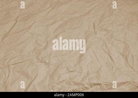 Top view beige crumpled wrapping paper. background Stock Photo