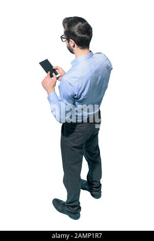 Man standing and using a smartphone on white background Stock Photo