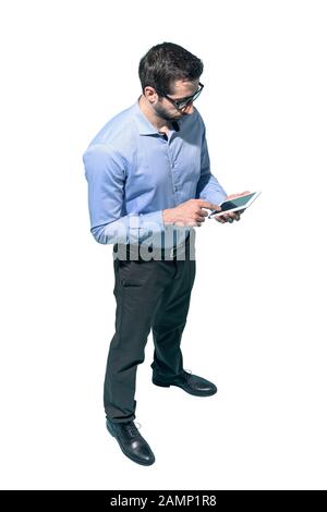 Man standing and using a smartphone on white background Stock Photo