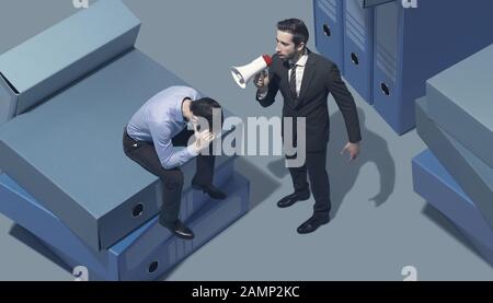 Bossy executive shouting at his employee with a megaphone, leadership and pressure concept Stock Photo
