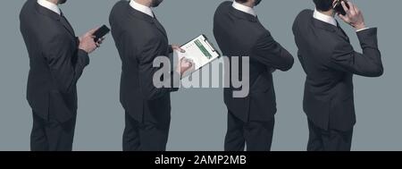 Corporate business people standing together in line, they are using smartphones and checking business reports: human resources and finance concept Stock Photo