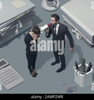 Angry boss shouting at his female employee using a megaphone, mobbing and leadership concept Stock Photo