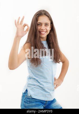 Girl shows ok sign on a white background Stock Photo