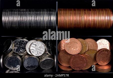 Black coin tray with one penny, two penny, five pence, and 10 pence pieces Stock Photo