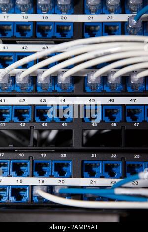 Close up shot of router cables in a data centre cabinet. Stock Photo