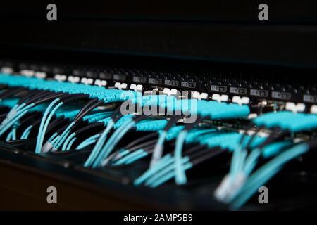 Close up shot of router cables in a data centre cabinet. Stock Photo