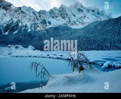 Snow covered Eibsee and Zugspitze in perfect light Stock Photo