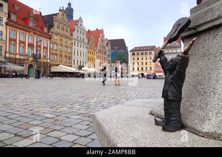 WROCLAW, POLAND - MAY 11, 2018: Gnome or dwarf with a guitar - small statue in Wroclaw, Poland. Wroclaw has 350 gnome sculptures around the city. Stock Photo