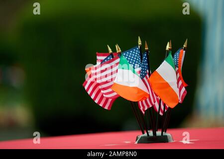 Miniature Irish and American flags used as a table decoration at a 4th of July party. Stock Photo
