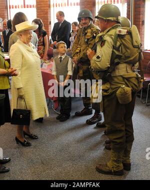 HM The Queen and Duke of Edinburgh visit the D-Day Museum in Portsmouth in 2009, dedicated to the decisive World War II victory 65 years after the Normandy invasion in June 1944. The Queen, wearing a cream coat and hat, viewed the Overlord Embroidery which charts the events of D-Day and features her father King George VI alongside Winston Churchill, Field Marshal Brooke and Generals Montgomery and Eisenhower. Stock Photo