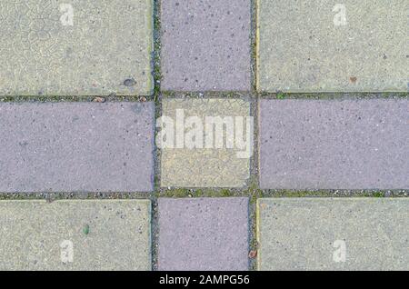 Stone road surface. Pedestrian pavement or stone walkway made of blocks. View from above. Stock Photo