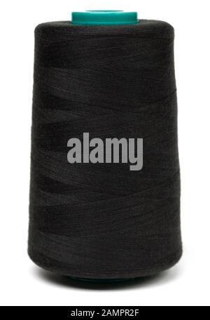 Spool of black synthetic or cotton threads isolated on white background. Spool of yarn using for weaving in textile manufacturing Stock Photo