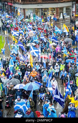 Glasgow, UK. 11th Jan, 2020. Demonstrators passing under the bridge crossing North Street during the march.80,000 supporters came out in support of Scottish Independence following the UK General Election and the upcoming date of January 31st when the UK will leave the European Union, dragging Scotland out of it against its will, as a result the group All Under One Banner held an Emergency march through the center of Glasgow to protest against both London rule and Brexit. Credit: Stewart Kirby/SOPA Images/ZUMA Wire/Alamy Live News Stock Photo