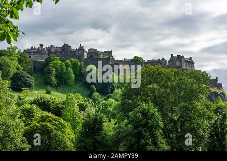 Edinburgh Castle in Scotland under a dramatic cloudy sky. Stock Photo