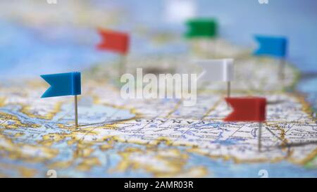 Travel destinations in Canada marked with pins on world map, tourism, closeup Stock Photo