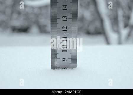 photo with a centimeter ruler as an indicator of snow depth Stock Photo