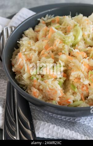 Fresh salad of raw cabbage, leeks and carrots, multivitaminico natural food Stock Photo