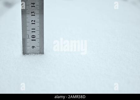 photo with a centimeter ruler as an indicator of snow depth Stock Photo