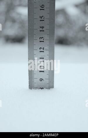 photo with a centimeter ruler as an indicator of snow depth Stock Photo