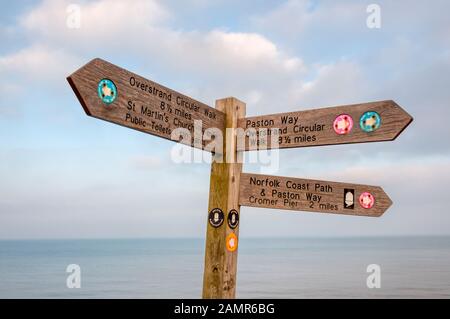 A waymark and signpost for the Overstrand Circular Walk, Norfolk Coast Path & Paston Way in Norfolk. Stock Photo