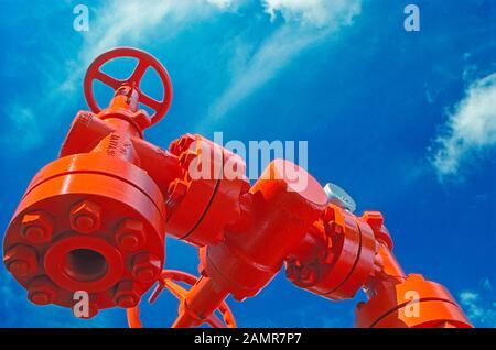 Manual shut-off valve on oil well. Oil well wellhead equipment Stock Photo