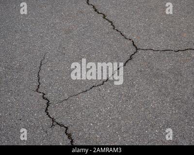 Warning cracks in the pavement in the asphalt Stock Photo