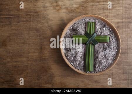 Ash wednesday, crucifix made of ash, dust as christian religion. Lent beginning Stock Photo