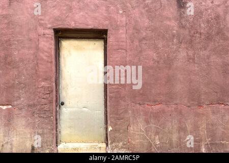 an abandoned alley back door od building Stock Photo