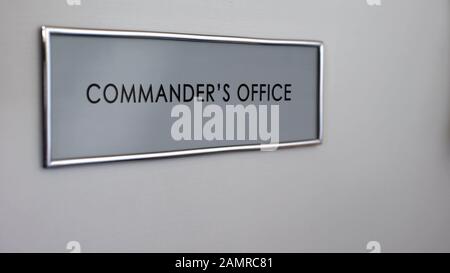 Commander office door desk closeup, army leadership and military authority Stock Photo