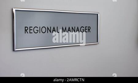 Regional manager office door, door desk, business department, company growth Stock Photo