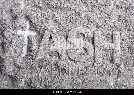 Ash wednesday word written in ash and christian cross symbol as a religion concept Stock Photo