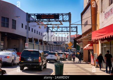 Vehicles passing through the U.S. Customs and Border Protection zone at the US-Mexican border in Nogales, AZ Stock Photo