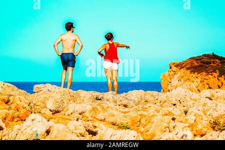 Couple in Chia Beach and Mediterranean Sea South Sardinia Italy reflex Stock Photo