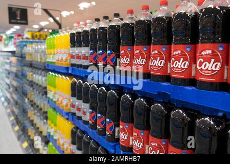 Fizzy sugar drinks for sale in plastic bottles in a UK supermarket. Stock Photo