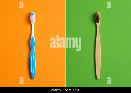 Plastic Toothbrush vs Eco-Friendly Bamboo Toothbrush. Comparison concept. No plastic, Zero Waste, Sustainable Lifestyle. Choice Plastic Free Oral Heal Stock Photo