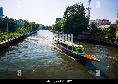 Bangkok/Thailand-05 December 2019: Colorful Bangkok ferry long boat on Khlong saen saep canal transporting people around the city. Stock Photo