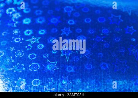Blue holographic background glitter texture with a star pattern can be used as a map background or Wallpaper. Stock Photo