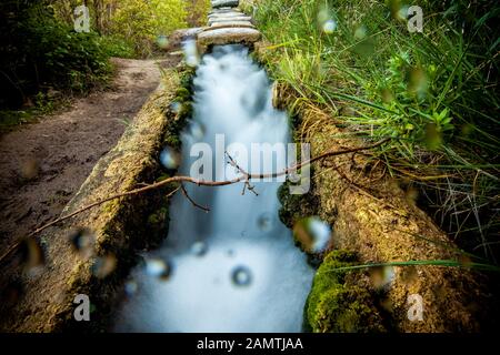 stone water channel full of running water in Tierra del Trigo village Stock Photo