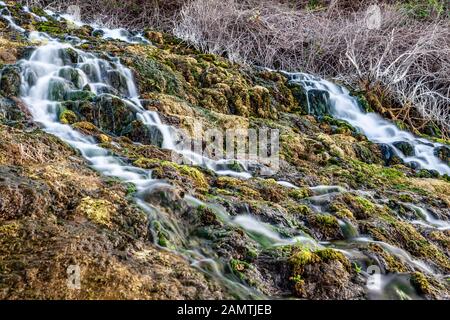 stone water channel full of running water in Tierra del Trigo village Stock Photo